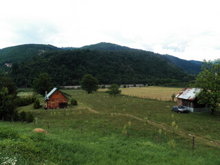 Landscape with hills, trees, clouds