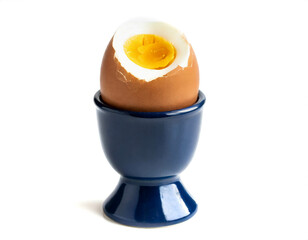 boiled eggs in egg cup isolated on white background, cut out