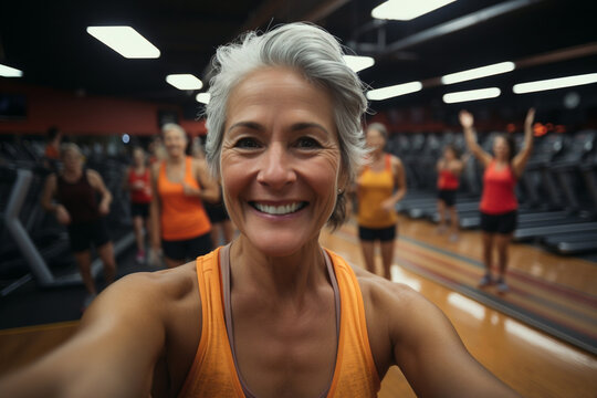 Old senior lady smiling happy for blog inspiration and progress post. Fitness, exercise fitness gym takes selfie portrait of female woman happy about workout training motivation body wellness.