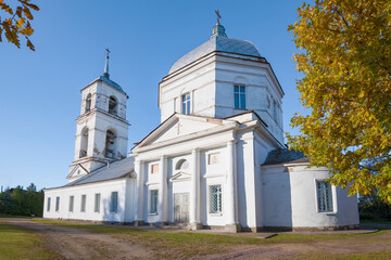 Fototapeta na wymiar Ancient Church of the Sign of the Icon of the Mother of God (1771) on a sunny October day. Tikhvin. Leningrad region, Russia