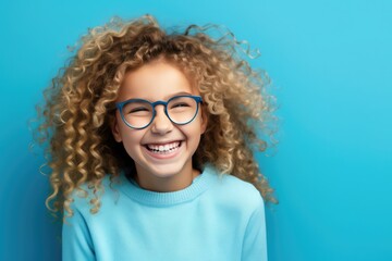 Curly Blond Girl With Glasses On Blue Background