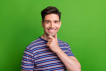 Photo of optimistic guy with stubble dressed striped t-shirt fingers touch chin think business...