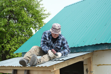 A retiree demonstrates self-sufficiency by personally repairing his home's roof, a testament to the active lifestyle of seniors today.