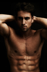 Fototapeta premium Abs, black background or portrait of man for workout, training or exercise in studio for fitness. Model, dark shadow or ripped male person with healthy body, six pack or stomach for wellness in Italy