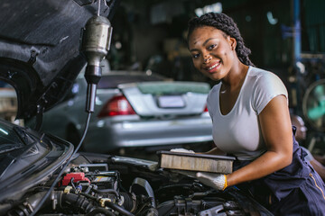 Mechanic is checking and change an air filter. Car mechanic working maintenance checking air filter...