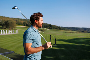 Dynamic Start: Young Man Initiates Golfing Adventure