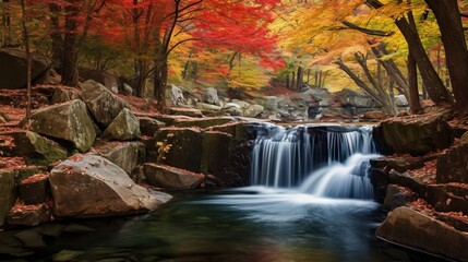 A cascading waterfall framed by vibrant autumn leaves, creating a stunning contrast of colors.