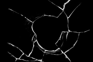 Broken glass from a bullet. Texture of broken glass.