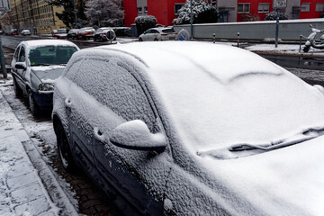 Snowy windshield of a parked car