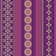Seamless purple and pink pattern with northern patterns. Symbols of the polar star and the sun in Laplane patterns.