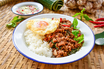 Rice topped with stir fried Thai basil with minced pork and fried egg, pad ka praow moo sap