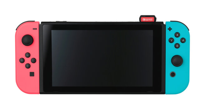 Nintendo Switch game console with the cartridge peeking out of it, isolated on white background. The Nintendo Switch is Nintendo seventh major home console platform, following the Wii U
