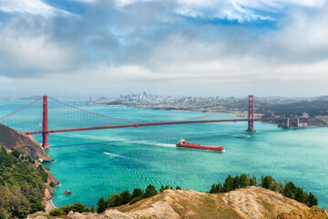 San Francisco skyline with Golden Gate Bridge in Golden Gate Bay in summer day, San Francisco, California.
