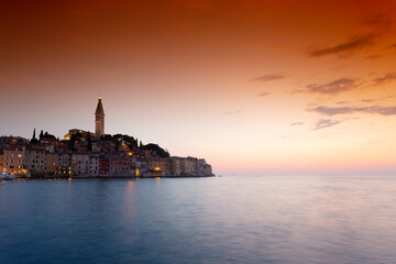 morning view of old  Rovinj town with multicolored buildings and yachts moored along embankment, Croatia. - 690341537