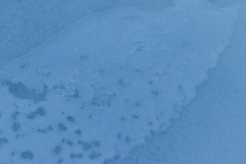 Texture of the ice surface. Winter background