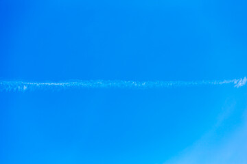 Landscape with beautiful cloudless blue sky background. with a white contrail. Beauty clear cloudy...