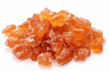 Foto op Plexiglas Heap of orange, amber colored raw dried gum arabic pieces on white background © artsterdam