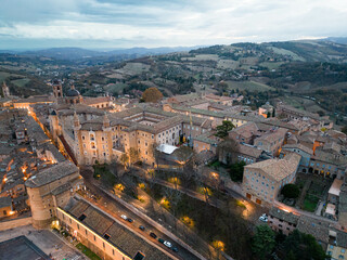 Fototapeta na wymiar Italy, 08 December 2023 - aerial view at dawn of the medieval village of Urbino in the province of Pesaro and Urbino, a UNESCO heritage site