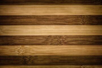 A wooden background of two different colored boards. Close up.