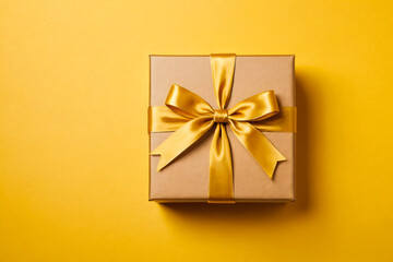 gift box with ribbon and bow on a yellow background