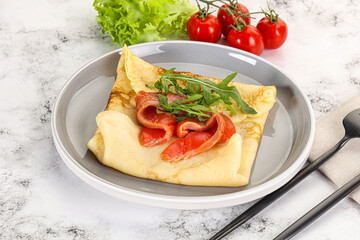 Russian pancake with salmon fish
