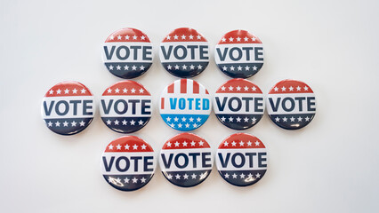 Group of red, blue and white vote buttons for presidental election 2024.  I voted badges isolated...