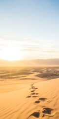 Fototapeta na wymiar Sunset over desert sand dunes with tranquil footprints possible usage in travel adventure or nature-themed displays