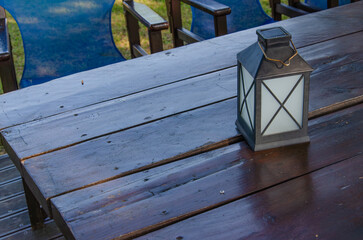 Candle lantern on a wooden table