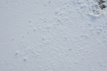 white snow texture as background, white snow surface photo from above, snowy asphalt surface, frozen winter road surface	