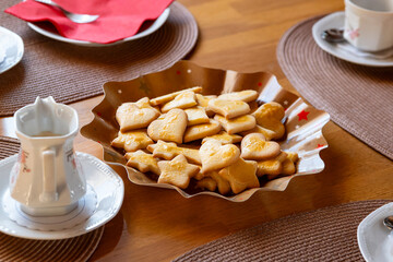 a table set for christmas with cookies