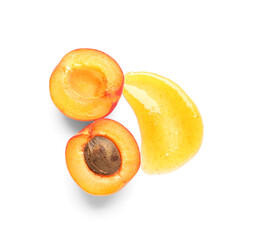 Sweet apricot and smear of jam on white background