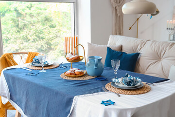 Table setting for Hannukah in dining room