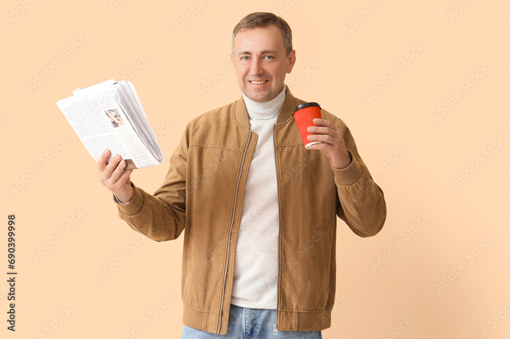 Canvas Prints mature journalist with newspaper and cup of coffee on beige background