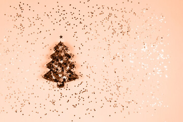 Christmas tree baking dish on a peach background. color of the year 2024