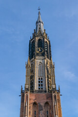 Fototapeta na wymiar Details of XV Nieuwe Kerk (New Church, 1396 - 1496) on Market square in Delft, Holland. New Church, with 108,5 m church tower - second highest church in The Netherlands. Delft.