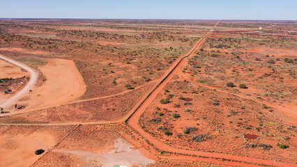 Cameron corner  South Australia where three states meet, New South Wales, Queensland and South Australia. The famous Dingo fence being the barrier.