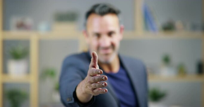 Hiring, face or businessman in handshake agreement, teamwork or introduction in office. Smile, mature manager blur or shaking hands for job promotion, deal negotiation or b2b partnership opportunity
