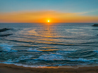 Fototapeta premium Sunrise seascape with high clouds