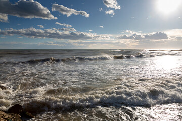 Waves crashing against breakwater and splashing water