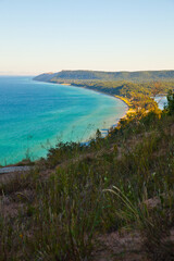 Obraz premium Golden Hour at Empire, Michigan: Lush Forested Coastline View from Above