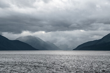Bay of Turnagain Arm Surrounded By Mountains With Storm Clouds Hovering Near Anchorage, Alaska