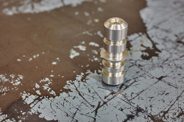 Precision Machined Metallic Component on Workshop Table