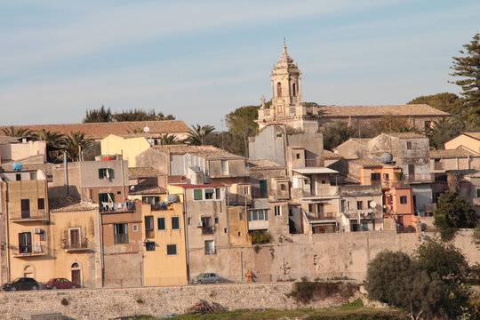 ragusa sicily italy town medium shot church buildings homes houses on hill unlevel uneven ground