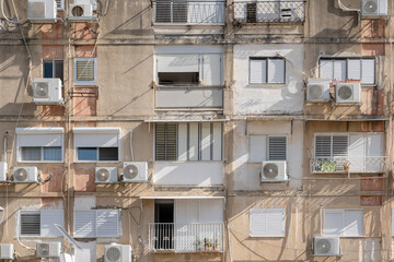 Typical old aged Architecture in Israel street. 60s buildings with facade walls . air conditioners...