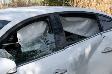 The car after a side impact deployed opened side airbags. Fast driving, emphasizing the importance...