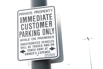 private property immediate customer parking only while on premises tagging and towing consequences...