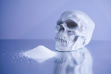 Sugar and a human's skull. Sugar is the most dangerous drug in a world. 