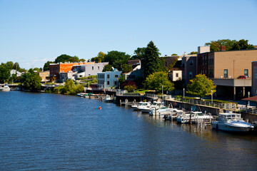 Fototapeta na wymiar Elevated View of Riverside with Docked Boats and Colorful Buildings in Michigan