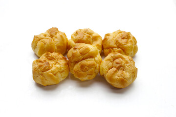 Cream puffs on white background