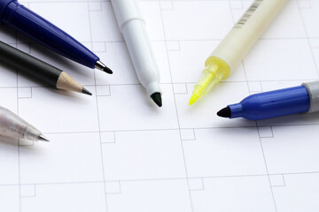 Calendar with pens and pencils. Planning concept